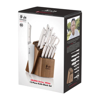 
                    
                      12-piece knife set with white handles in a wooden block, including various knives and kitchen scissors.
                    
                  
