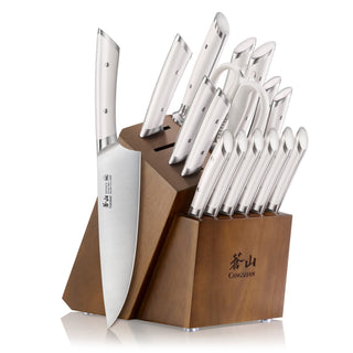
                    
                      17-piece knife set with stainless steel blades and white handles in a wooden acacia block with knife slots.
                    
                  