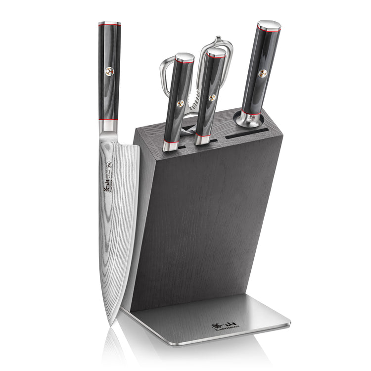 Six-piece knife block set with four knives and two kitchen tools in a black wooden block with stainless steel base.