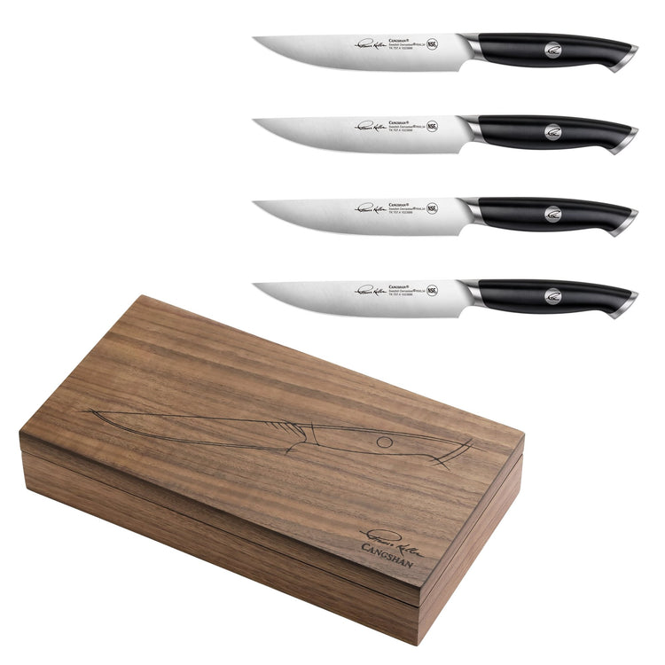 Four black-handled steak knives with stainless steel blades and a walnut storage box with knife illustration and signature.