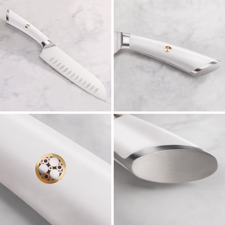 White-handled Santoku knife with a stainless steel blade featuring hollow edge indentations and a decorative circular emblem