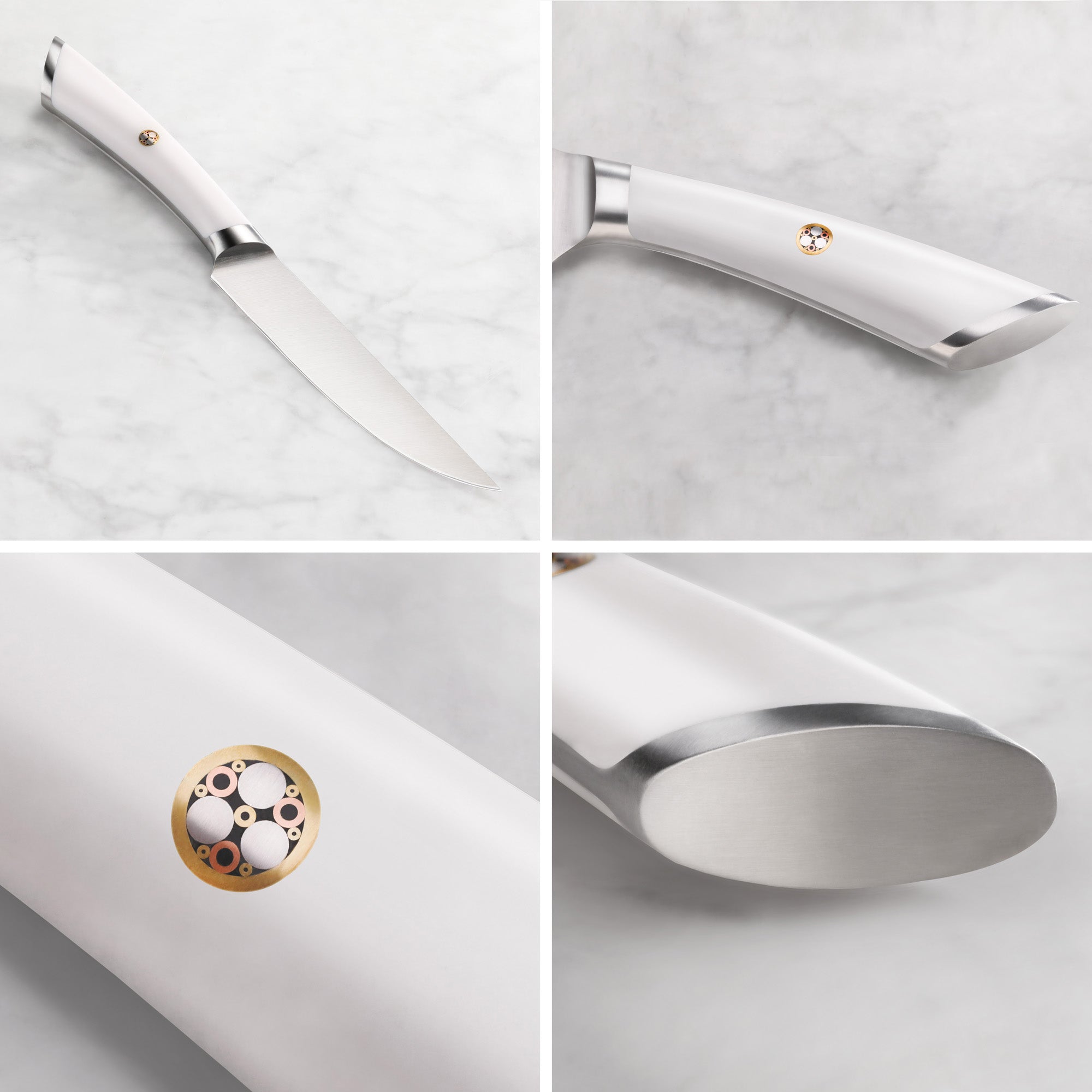 Steak knife with white handle featuring a circular metal emblem and polished stainless steel blade and bolster.