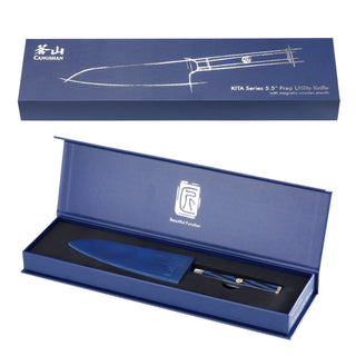 
                    
                      Blue Damascus steel 5.5-inch prep utility knife with black handle, displayed in open blue box with lid.
                    
                  