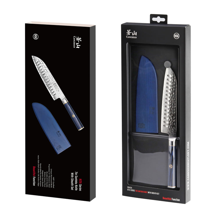 Santoku knife with hammered blade and blue sheath in black retail packaging.