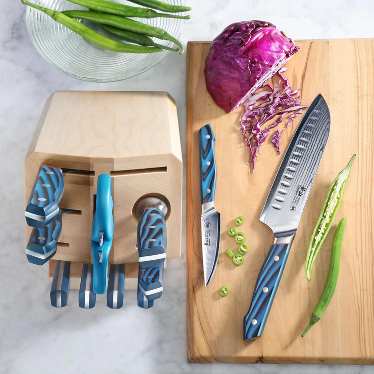 12-piece knife block set with blue-handled knives, including a large chef's knife and paring knife, on a wooden cutting board