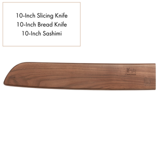 
                    
                      Walnut magnetic knife sheath with saya style blade protection, engraved with branding on the side.
                    
                  