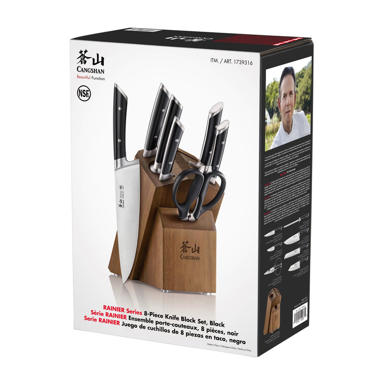 8-piece knife set with black handles, including scissors, stored in an acacia wood block.
