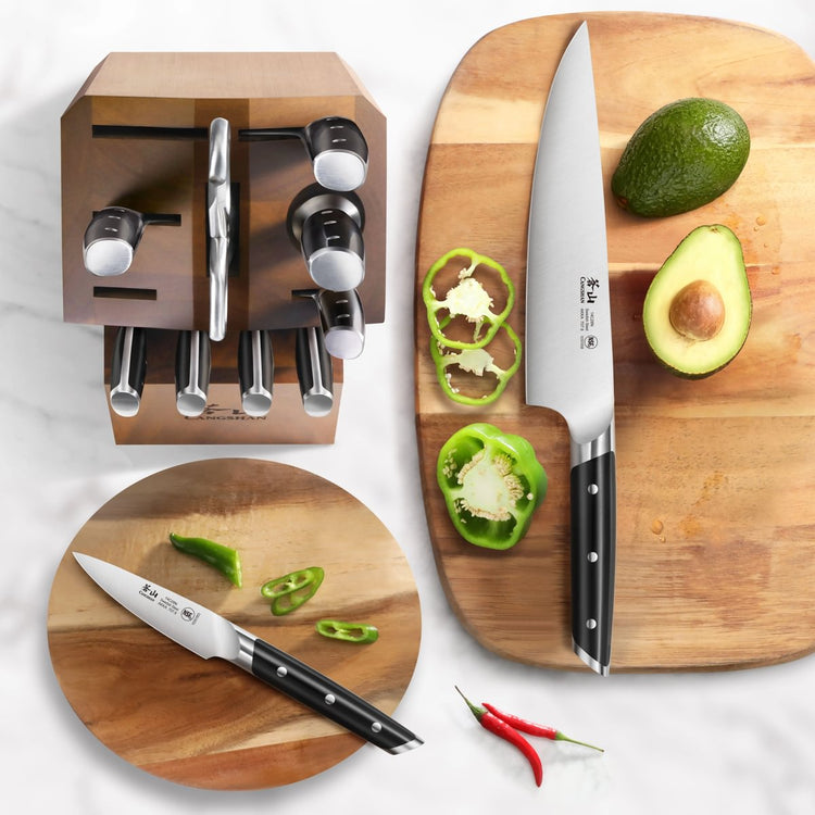12-piece knife set with wooden block, featuring various knives displayed with sliced green pepper, avocado, and chili on cutt