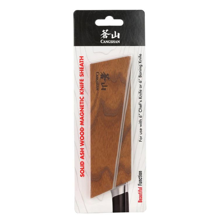 Solid ash wood magnetic knife sheath displayed in packaging with a knife partially inserted.