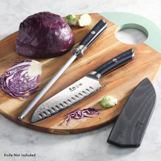 
                    
                      9-inch honing steel with black handle and a knife with black handle on a wooden cutting board with cabbage and Brussels sprou
                    
                  