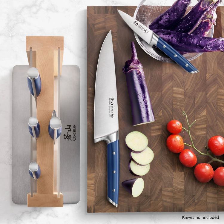 HUA Magnetic Knife Block with clear blade guard holding four knives, next to a cutting board with a chef's knife, sliced eggp