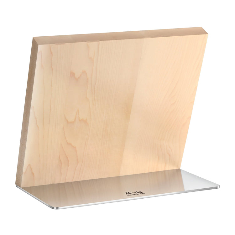 Rectangular wooden knife block with a slanted top edge on a flat metal base.