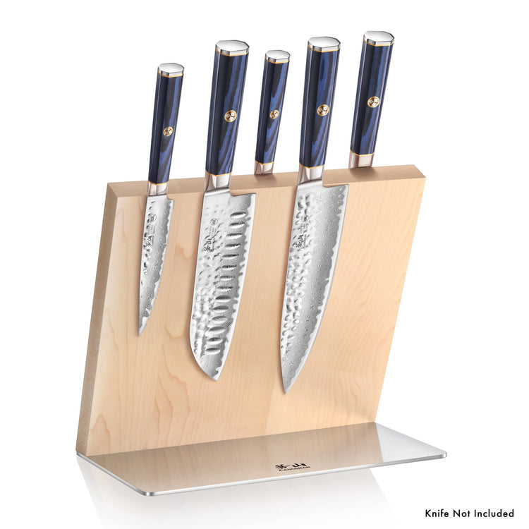 Magnetic wooden knife block holding five knives with hammered steel blades and dark blue handles.