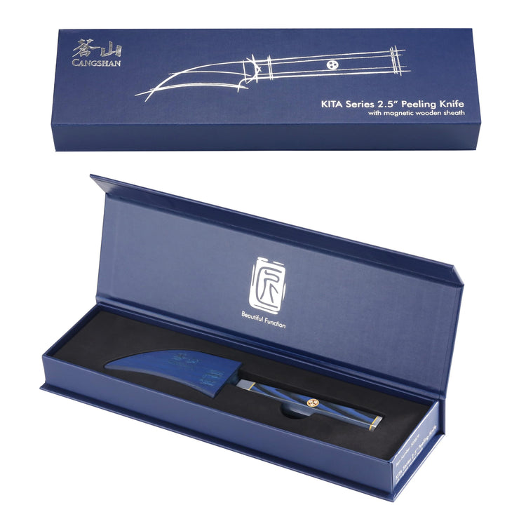 Blue peeling knife with curved blade and sheath, displayed inside an open blue presentation box.