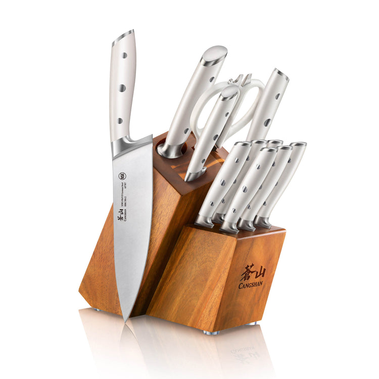 12-piece knife set with stainless steel blades and handles, stored in an acacia wood block with logo.