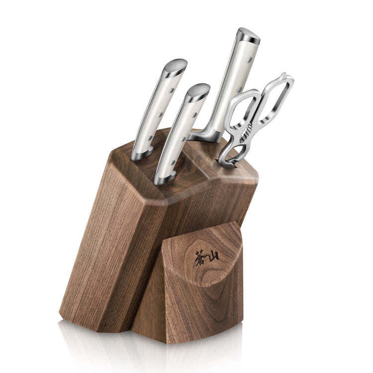 Set of three stainless steel knives and a pair of scissors in a wooden knife block with a small compartment.