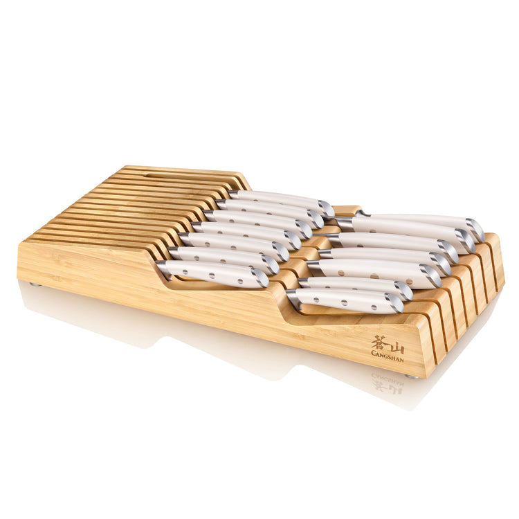 15-piece knife set with white handles organized in a bamboo in-drawer tray with slots for each knife.