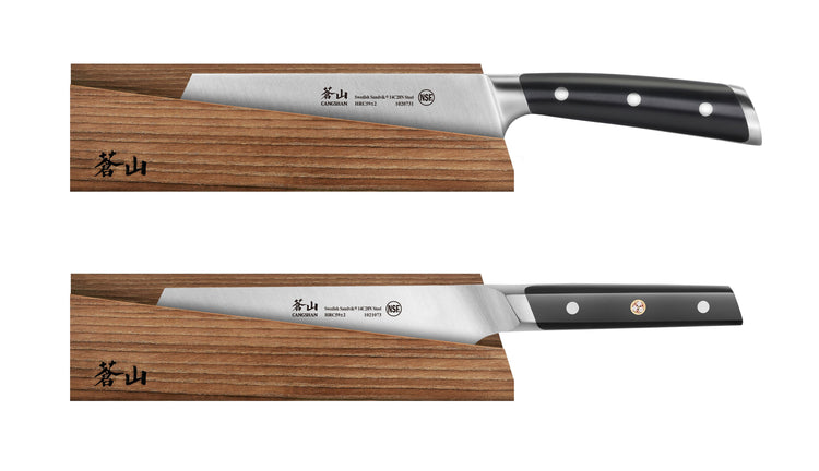 Two kitchen knives with black handles magnetically attached to a solid ash wood sheath with Japanese characters.