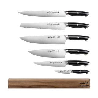 
                    
                      Six knives with black handles and stainless steel blades arranged vertically above a wooden magnetic knife block.
                    
                  