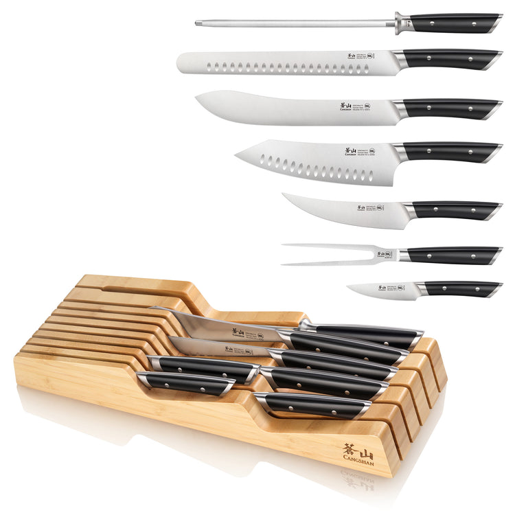 Eight-piece knife set with black handles, including sharpening steel and bamboo in-drawer storage tray.
