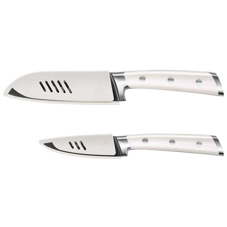 Two white-handled kitchen knives with metal bolsters and ventilation holes in the blades.