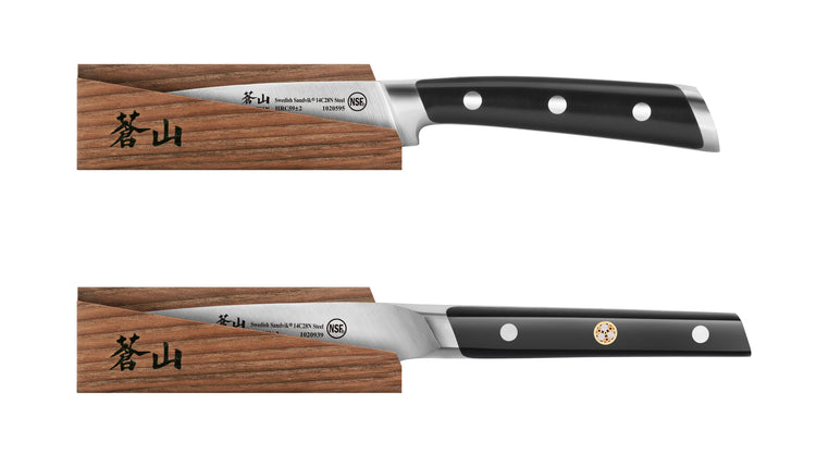 Two kitchen knives with black handles and three rivets each, partially inserted into solid ash wood magnetic sheaths.