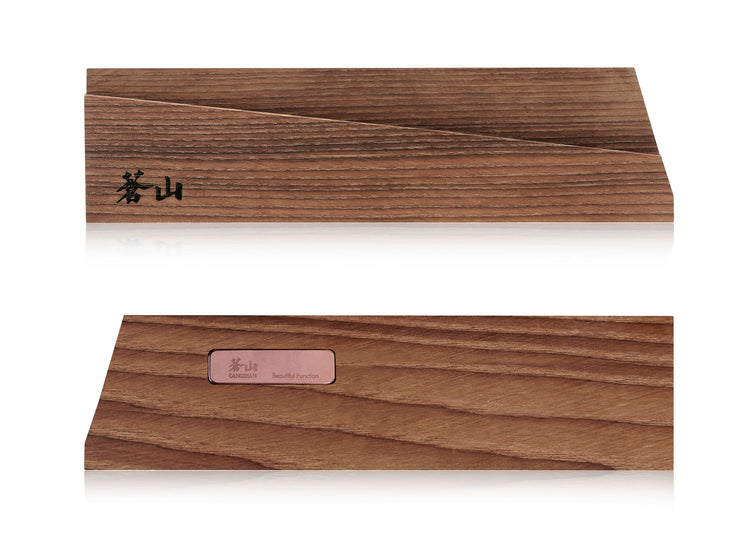 Solid ash wood magnetic knife sheath with a slanted top edge and engraved black characters on one side.