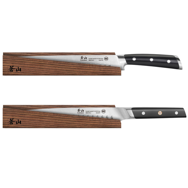 Two kitchen knives with black handles partially inserted into solid ash wood magnetic sheaths, displayed horizontally.