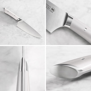 
                    
                      8-inch chef's knife with white handle, showing full blade, handle details, and blade spine on marble surface.
                    
                  