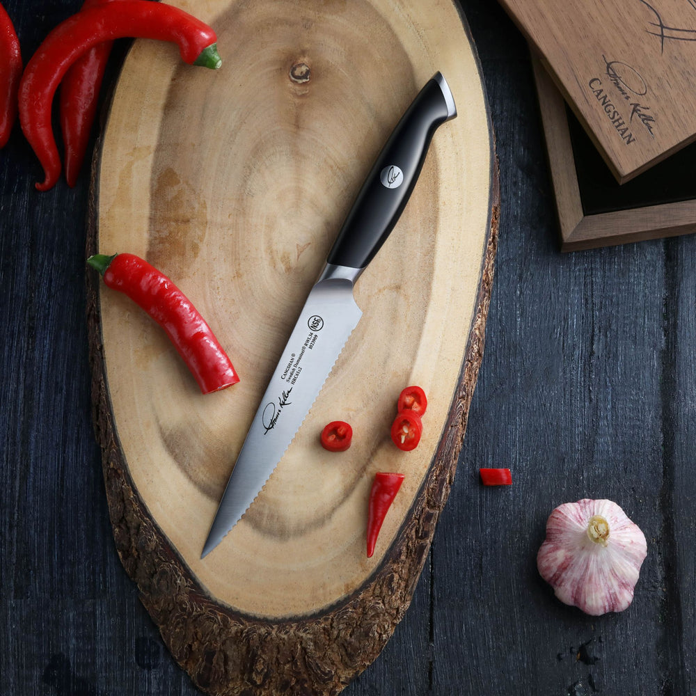 
                  
                    Load image into Gallery viewer, TKSC 5-Inch Serrated Utility Knife, Forged Swedish Powder Steel, Thomas Keller Signature Collection, 1023909
                  
                