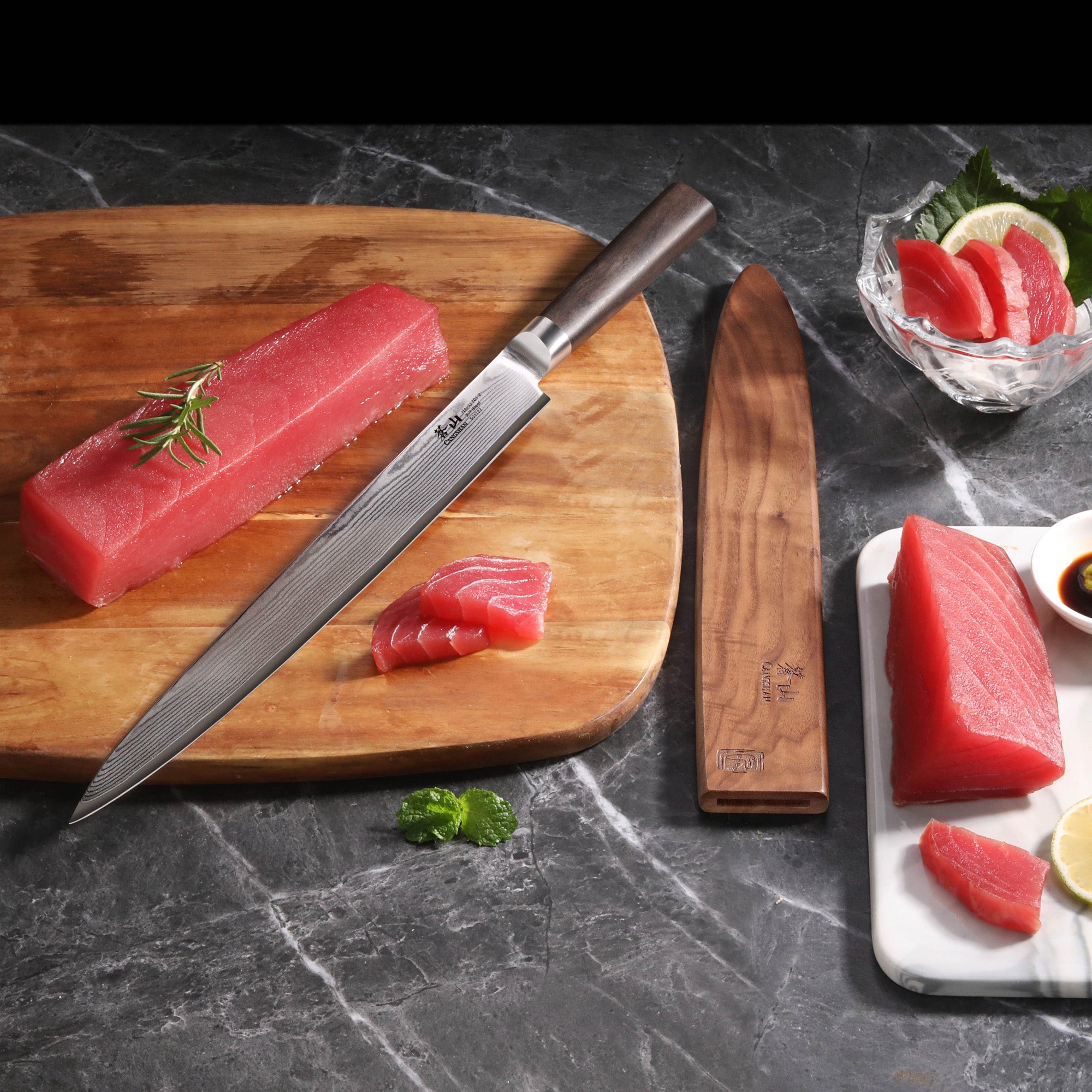 12-inch sashimi knife with Damascus steel blade and African Blackwood handle, next to sliced tuna on cutting board and plate.