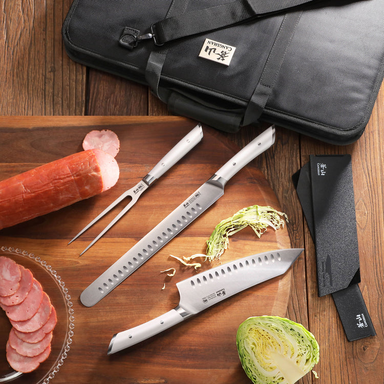 Nine-piece BBQ knife set with two knives, carving fork, black carrying bag, and sliced sausage on wooden board.