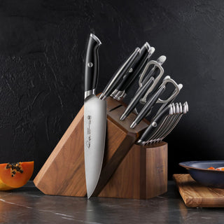 
                    
                      TKSC 17-piece knife block set with forged steel knives and kitchen shears stored in a wooden knife block.
                    
                  