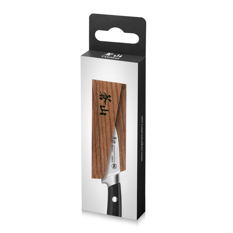 Solid ash wood magnetic knife sheath covering the blade of a kitchen knife in retail packaging.