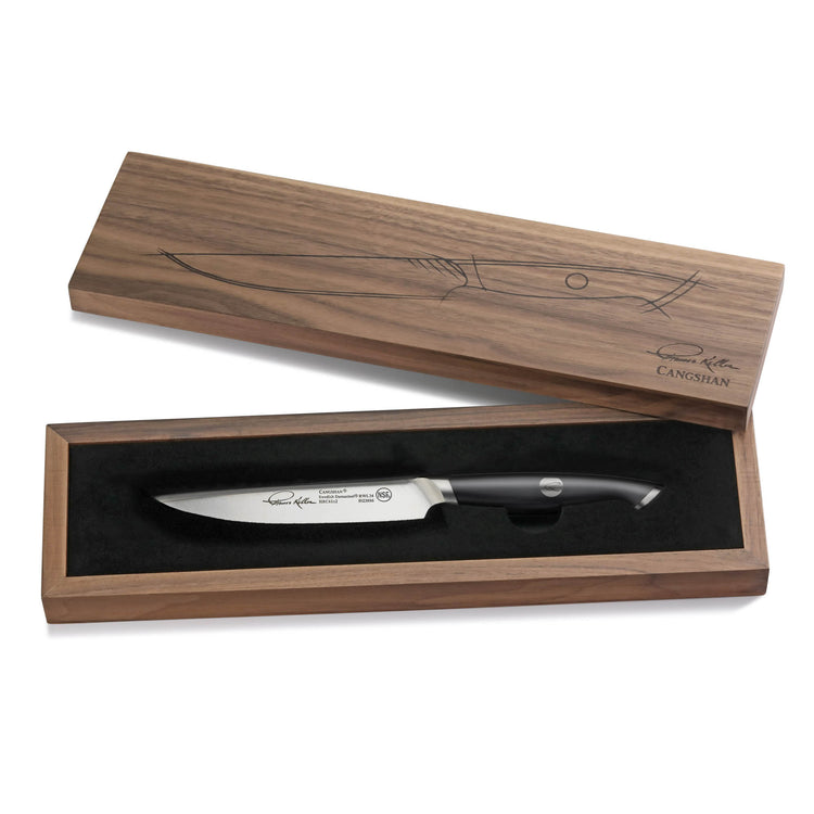 Single black-handled steak knife with engraved blade in a wooden presentation box with fish illustration on the lid.