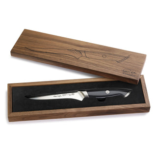 
                    
                      6-inch boning knife with black handle in wooden box featuring engraved fish design on lid.
                    
                  