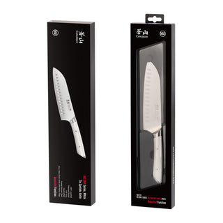 
                    
                      7-inch Santoku knife with white handle, displayed alongside its black retail packaging with product details.
                    
                  