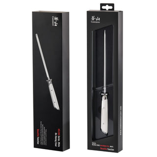 
                    
                      Honing steel with white handle displayed outside and inside black retail packaging.
                    
                  