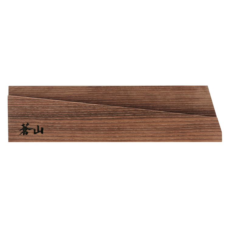 Solid ash wood magnetic knife sheath with a diagonal groove and black Japanese characters on one end.