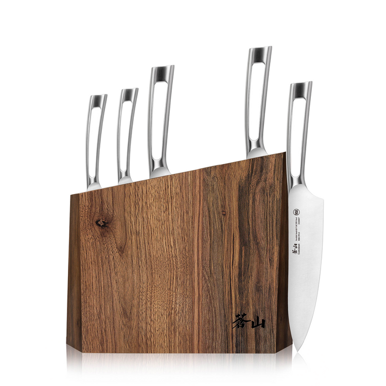 Walnut knife block holding five stainless steel knives with hollow handles, one knife partially removed.