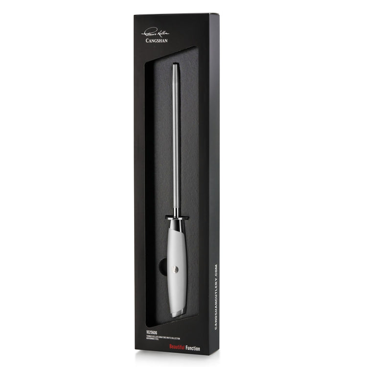 White-handled honing steel with a long metal rod, displayed in black packaging with branding.